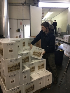 Finished cases coming off the bottling truck.